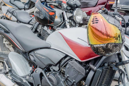 Tver Russia - April 21 2021: Close-up image of modern motorcycles of various brands and models. Striking nickel-plated details, engineering design. Techno art style background imageの写真素材
