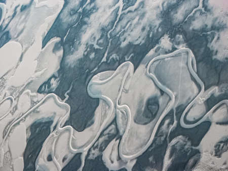 Aerial photograph of the winter landscape of the Earth's surface. Blur the perspective of the...