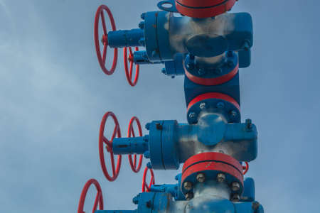 Gas well spout fittings with high-pressure valves and round hand wheels to regulate the flow of gas produced from the wellの写真素材