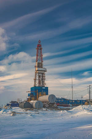 A general view of a drilling rig for drilling wells at an oil and gas field in the Arctic region. Winter. day. Drilling equipment and technical infrastructureの写真素材