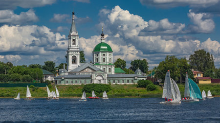 Tver Russia July 17, 2022: Yacht competitions on the river in summer on a sunny day. There are green trees in the background. beautiful cloudy skyのeditorial素材