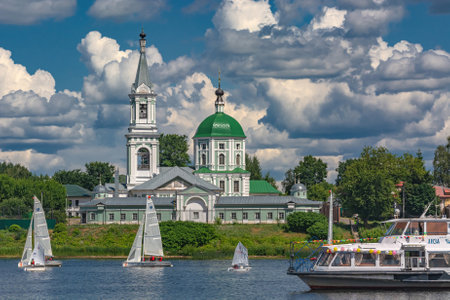 Tver Russia July 17, 2022: Yacht competitions on the river in summer on a sunny day. There are green trees in the background. beautiful cloudy skyのeditorial素材