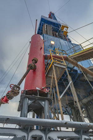 Drilling rig and drilling rig equipment for drilling oil and gas wells. winter day. Snow lies on the...