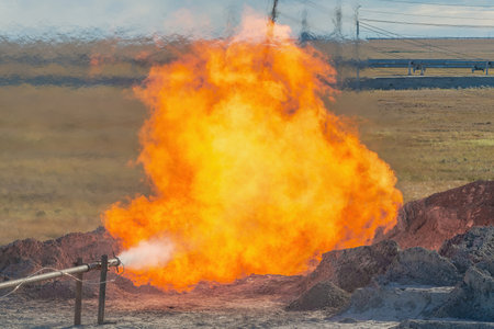 The Arctic gas source. Combustion of reservoir fluid during well testing and development. The bright flame of the torch as a symbol of energy and the elements bursts out of the bowelsの写真素材