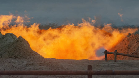 The Arctic gas source. Combustion of reservoir fluid during well testing and development. The bright flame of the torch as a symbol of energy and the elements bursts out of the bowelsの写真素材