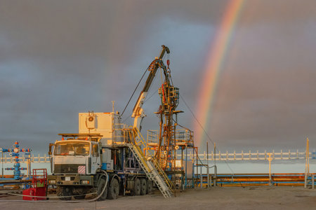The Northern gas field. Summer. Installation for lowering a flexible pipe into a well. Equipment for testing and development of a gas wellの写真素材