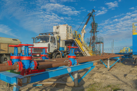 The Northern gas field. Summer. Installation for lowering a flexible pipe into a well. Equipment for...