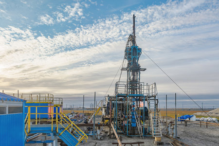 The Northern gas field. Summer. Installation for lowering a flexible pipe into a well. Equipment for testing and development of a gas wellの写真素材