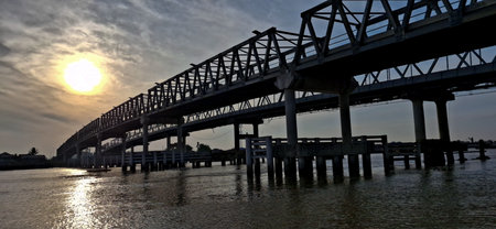 Kapuas II Bridge when the sun rises from the eastの写真素材