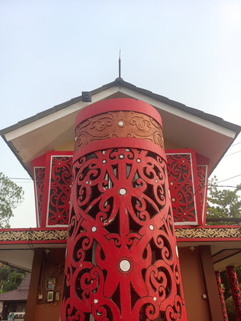 Pontianak - June 9, 2025 : Beautiful carvings typical of the Dayak tribe of West Kalimantan at the Pontianak drive-thru tax officeの写真素材