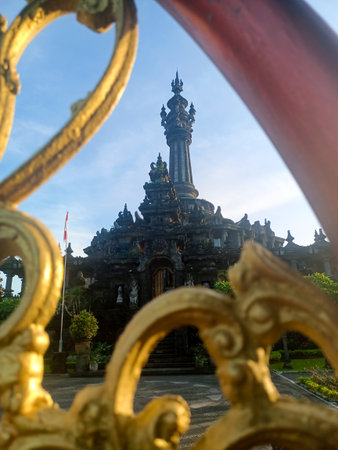 An unique perspective of the Bajra Sandhi Monument, framed by the gold-colored metal ornaments of the railing in the foregroundの写真素材