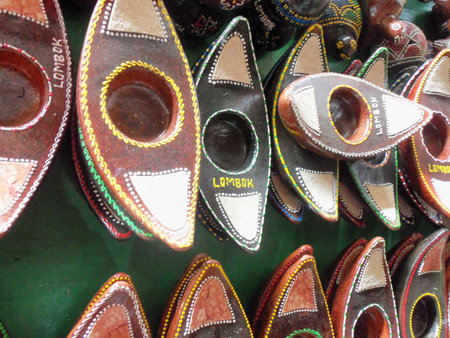 Handcrafted Lombok souvenirs and Indonesian gifts, featuring unique boat-shaped candle holdersの写真素材