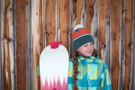 Content sportive girl with snowboardの写真素材