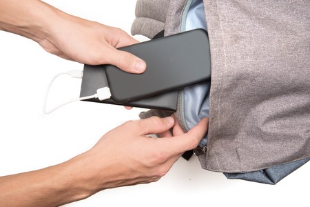 power bank and smartphone in ba?kpack