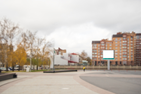 Blank billboard on the square near building in cityの写真素材