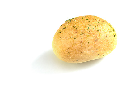 Bread with the green garlic on the surface on a white background. Isolated.の写真素材