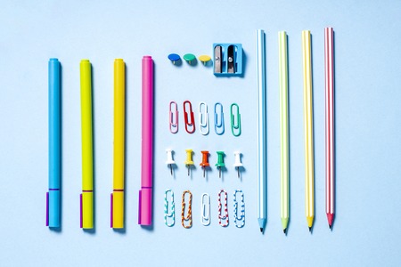 A set of colorful beautiful stationery is folded neatly on a blue backgroundの写真素材