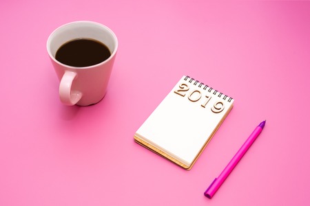 A notebook c an inscription 2019 for records plans, goals, objectives on purple tableの写真素材