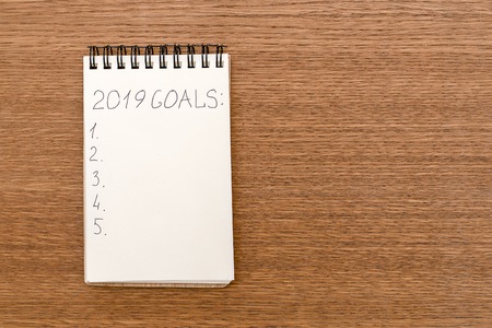 Notebook for recording purposes for 2019 on wooden table