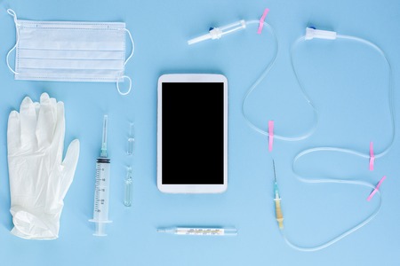 Various medical equipment and tablet on blue background. The view from the top.の写真素材
