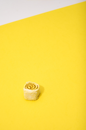 Turkish sweets yellow one on yellow backgroundの写真素材