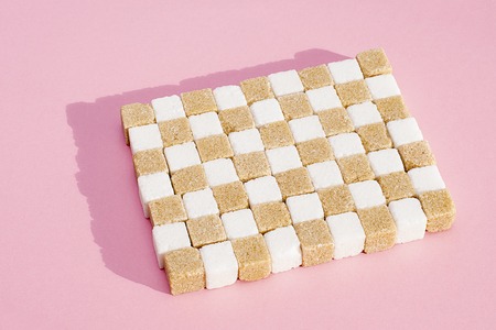White and grey sugar refined sugar arranged in cubic order. Pink bangroundの写真素材