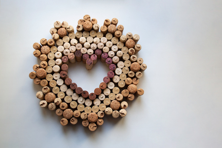 Wine corks heart shaped valentine badge isolated on white background from a high angle viewの写真素材