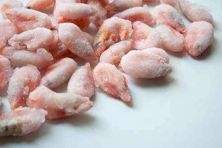 Frosted shrimps on white background close up