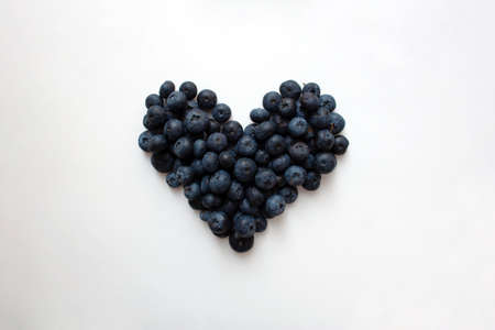 Blueberry heart shaped composition isolated on white backgroundの写真素材