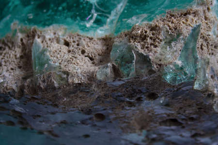 Textured turquoise glass rock abstract background