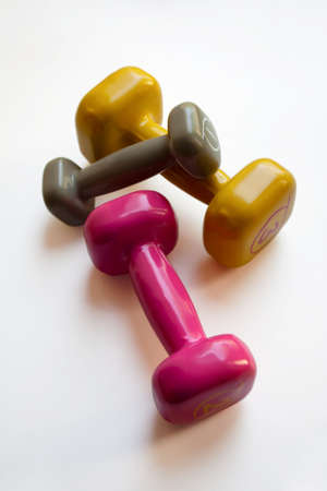 Colorful dumbbells set isolated on white background