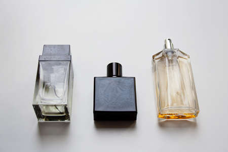 Three glass perfume bottles isolated on white backgroundの写真素材