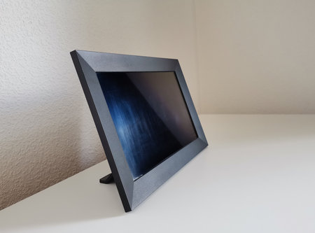 Black picture frame mockup with a copy space on white countertop