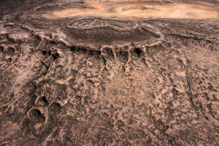 A pattern of rocks that have been eroded by water, Bueng Khan THAILANDの写真素材