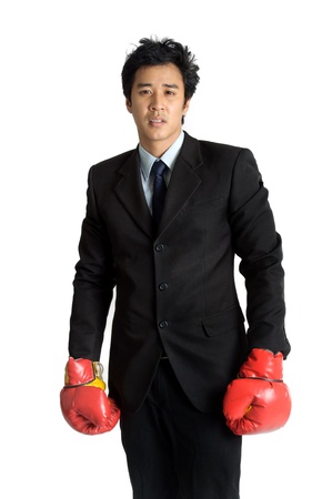 Business man  boxing glove in suit isolatedの写真素材