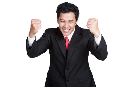 business man smart happy sucess in suit isolatedの写真素材