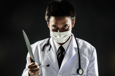Doctor man Serial Killer psychosis hold knifeの写真素材