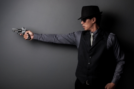 killer and mafia man hold gunの写真素材