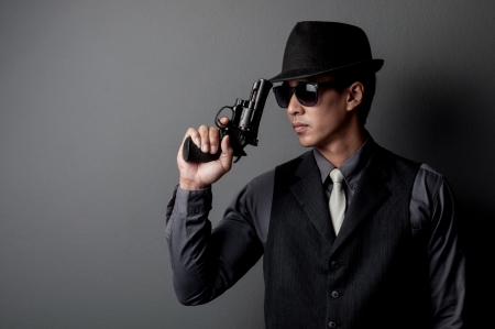 killer and mafia man hold gunの写真素材
