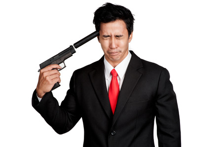 business man asian hold gun in suitの写真素材