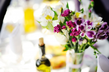 Restaurant  Wedding banquet, served table with a bottle of vineの写真素材