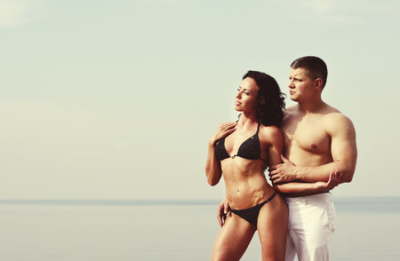 young caucasian couple at the sea side togetherの写真素材