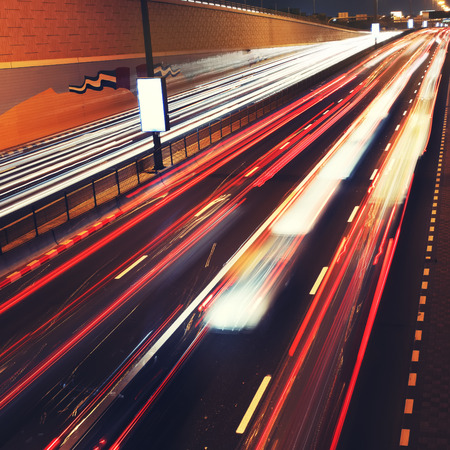 Traffic lights in motion blur on road of Dubai. City never sleeps.の写真素材