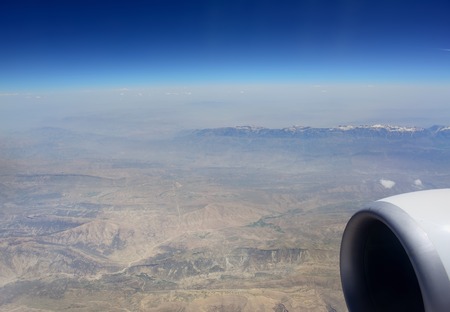 Flying over Syria. Ten kilometers  high over clouds.  Looking through window aircraft.の写真素材