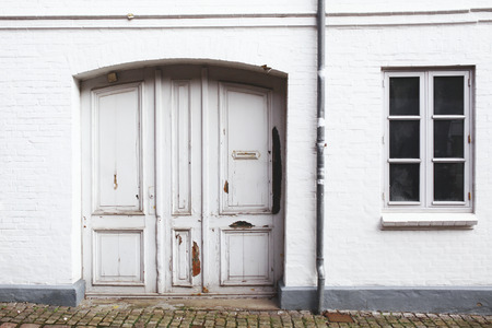 Old danish house. White doors. Windowsの写真素材