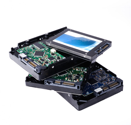 SSD vs HDD, new and old technology, isolated on white