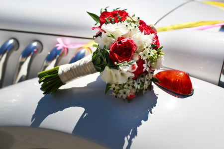 Bridal bouquet on wedding limo.の写真素材
