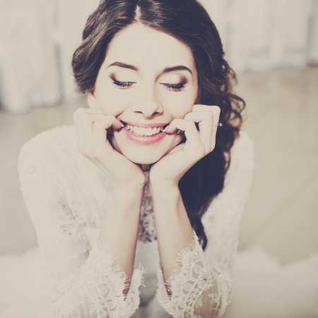 Wedding emotional portrait of happy brunette bride.の写真素材