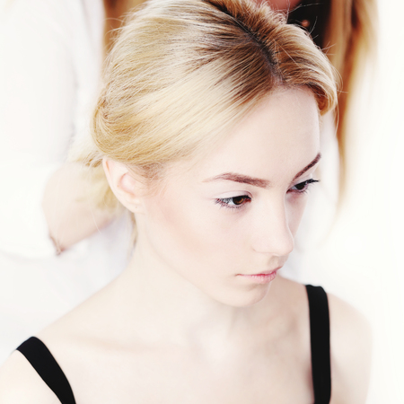 Hairdresser doing a new haircut to female customer.  Concept of beauty and fashion.の写真素材