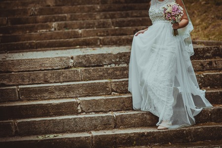 Beautiful bride with bouquet on wedding day.の写真素材
